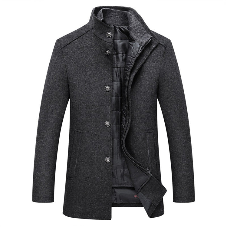 The Teal Simba Winter Men Wool Jacket is a slim fit, thick and warm dark gray coat with a funnel neck, button front, two side pockets, and black quilted lining. Asian size. Displayed on white background.