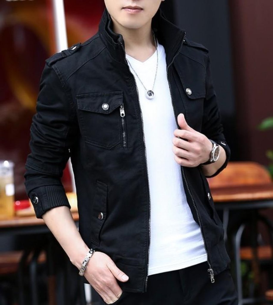 A person wearing a black Yellow Pandora Mens Military Theme Short Jacket over a white V-neck T-shirt, with a silver watch, chain necklace, and bracelet, stands outdoors. Their face is partially out of frame.